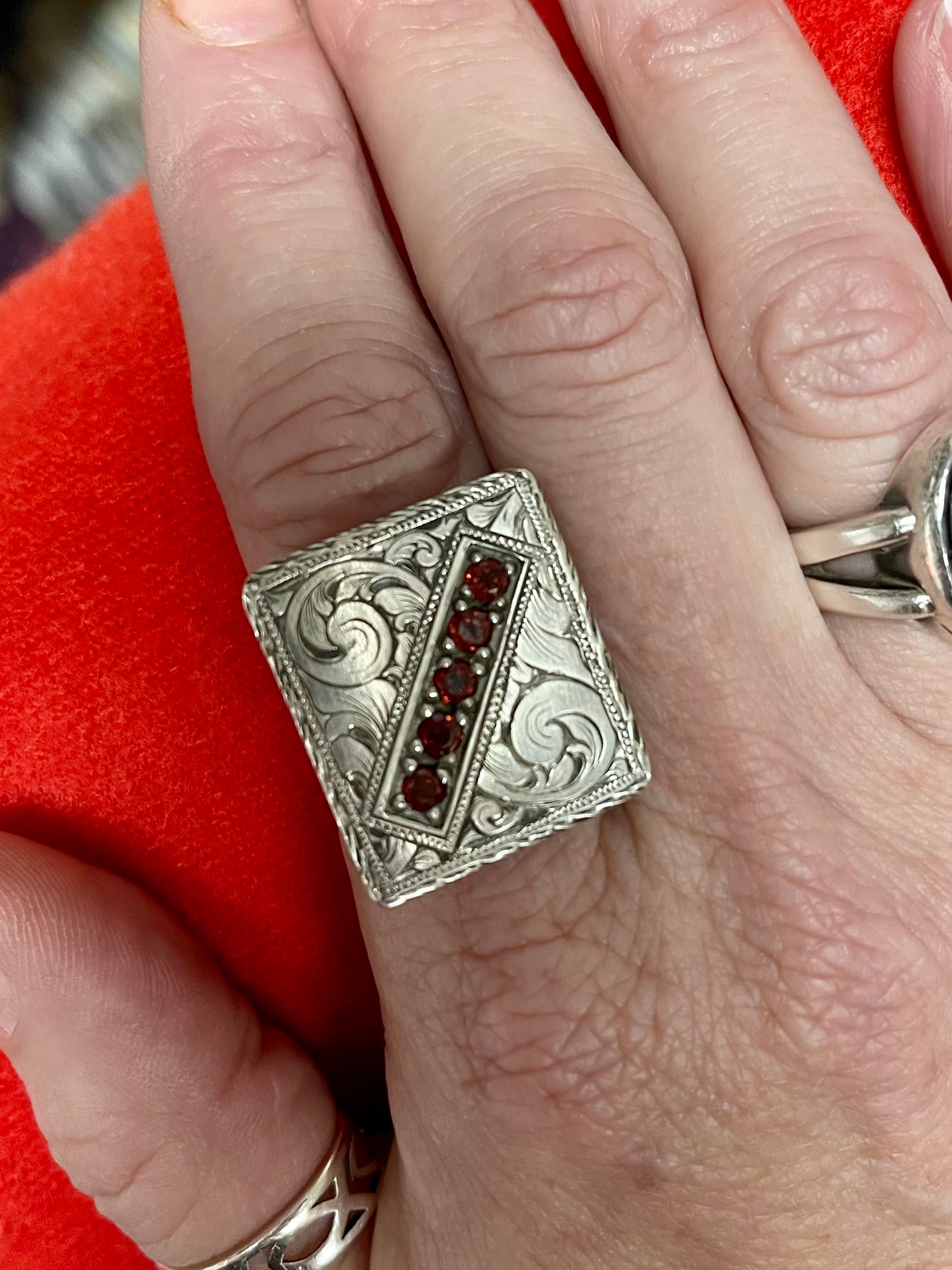 Hand engraved, Sterling silver, Flat Top Ring with 5 garnet stones.  Price may vary by stone.