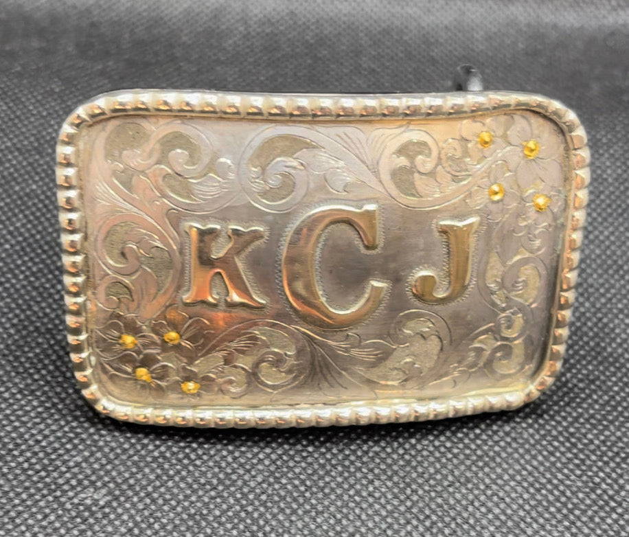 Handmade and hand engraved western style belt buckle. German Silver border and letters, and 24K gold inlays dots.   Fits 1 1/2“ belt.  CUSTOM ORDER