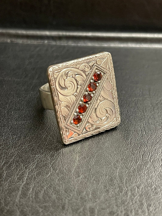 Hand engraved, Sterling silver, Flat Top Ring with 5 garnet stones.  Price may vary by stone.