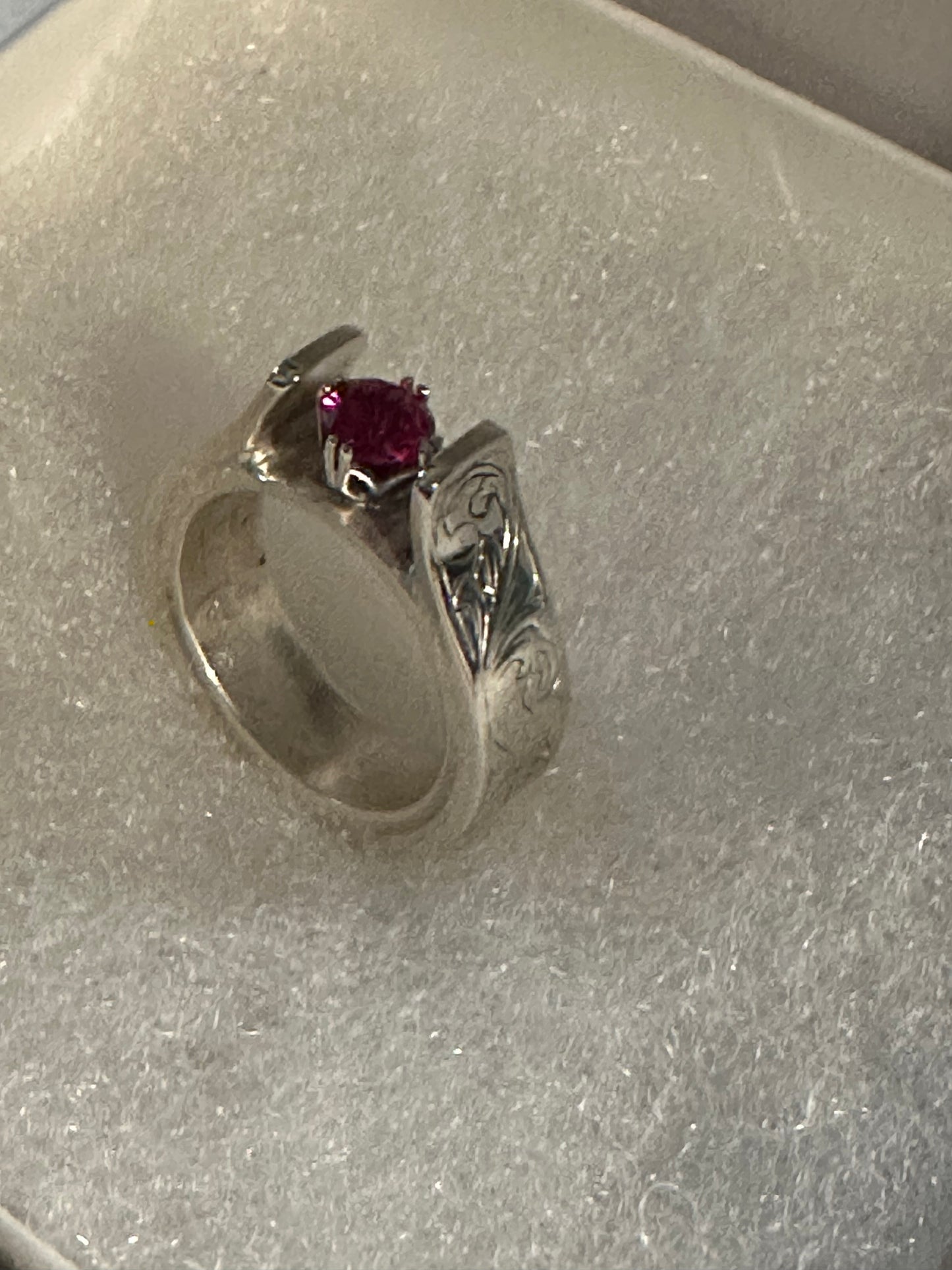 Sterling Silver, hand engraved with stone of choice (lab grown ruby pictured).  Price may vary due to choice of stone.     CUSTOM ORDER