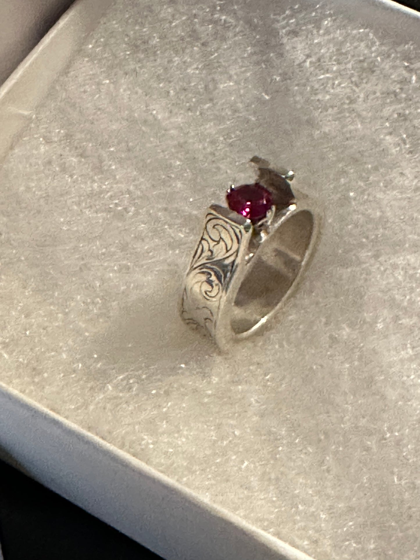 Sterling Silver, hand engraved with stone of choice (lab grown ruby pictured).  Price may vary due to choice of stone.     CUSTOM ORDER