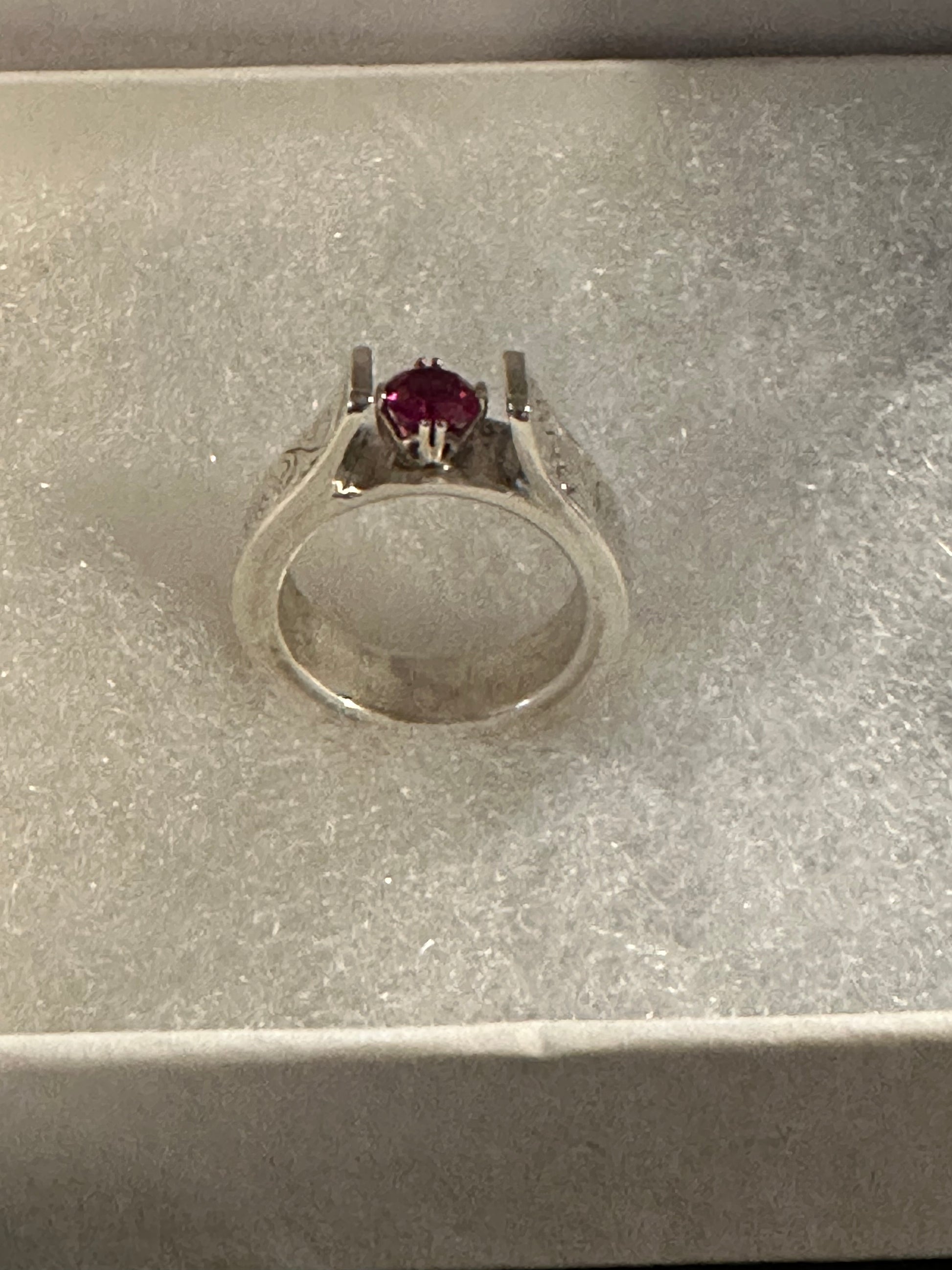 Sterling Silver, hand engraved with stone of choice (lab grown ruby pictured).  Price may vary due to choice of stone.     CUSTOM ORDER